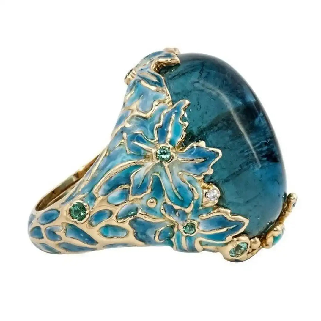 Anillo Elegante de Flor Dorada con Piedra Azul